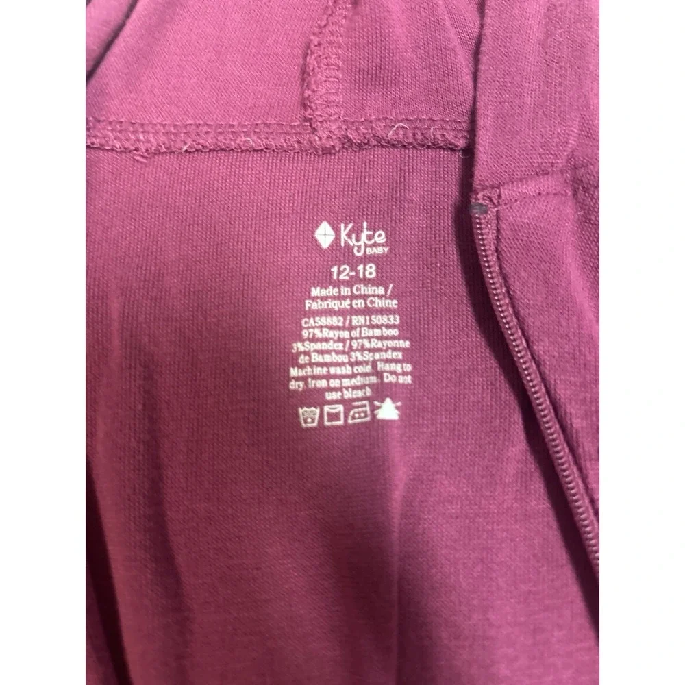 Kyte Baby Bamboo Jersey Hooded Zippered Romper in the color Dahlia